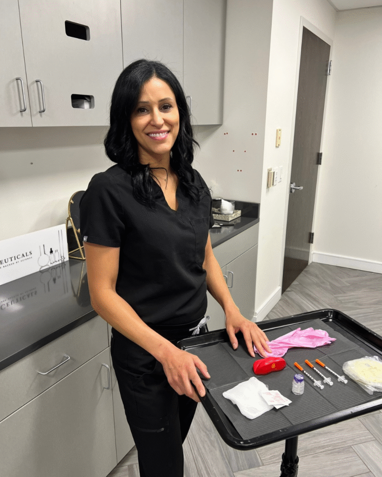 Smiling healthcare professional in black scrubs standing by a prep cart with medical supplies in a clinic. (informative)